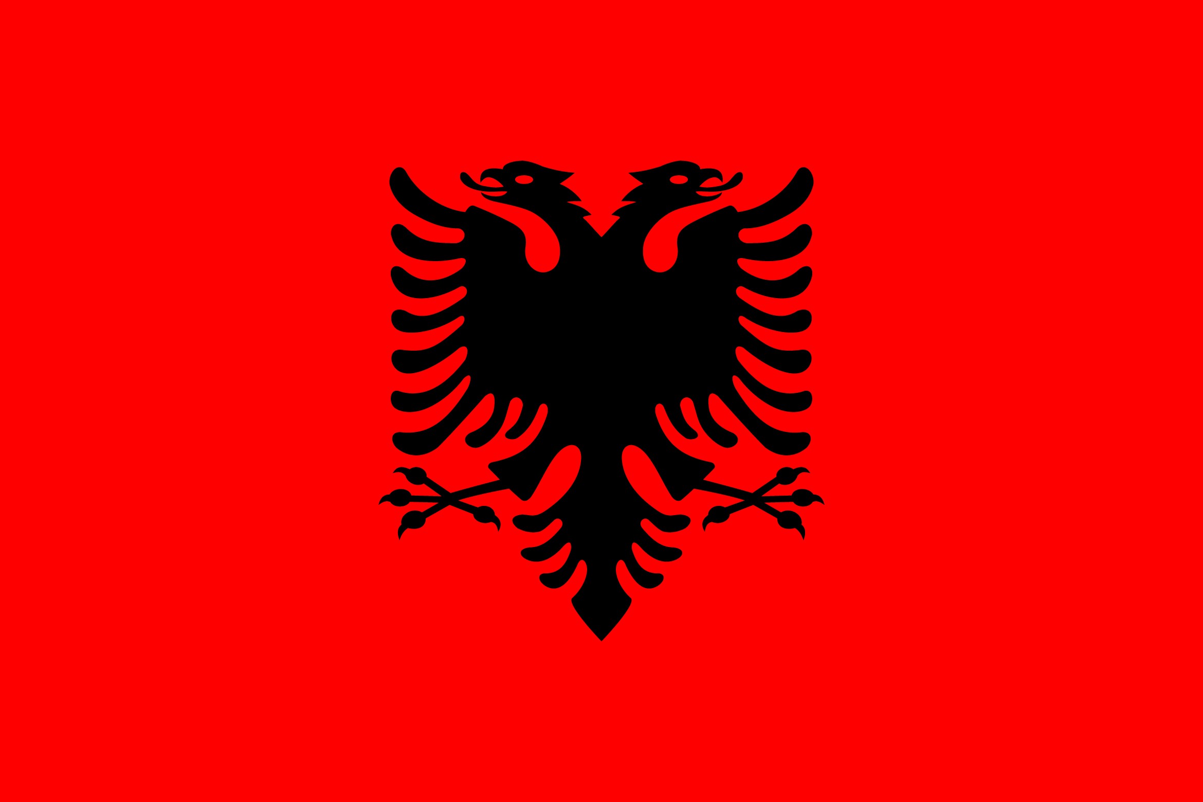 Die Flagge Albaniens mit einem schwarzen, doppelköpfigen Adler auf rotem Grund.